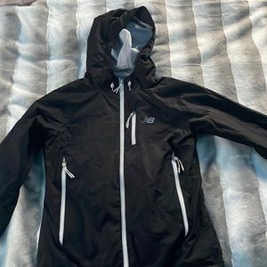 Black new balance, rain jacket , women’s